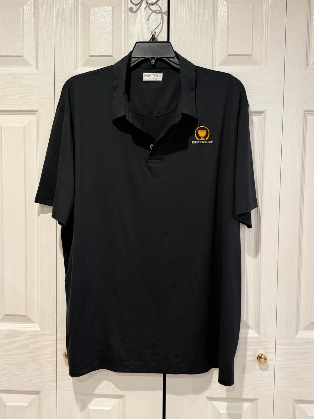 PGA TOUR Black Polo with Yellow Presidents Cup Logo